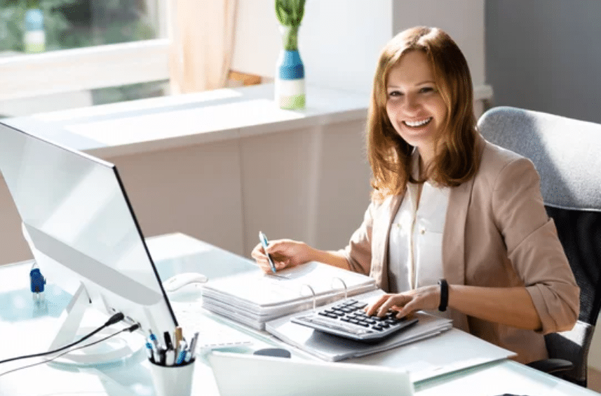 Business womansmiling after outsourcing accounting services