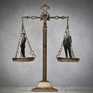 Legal accountants stand on justice scales